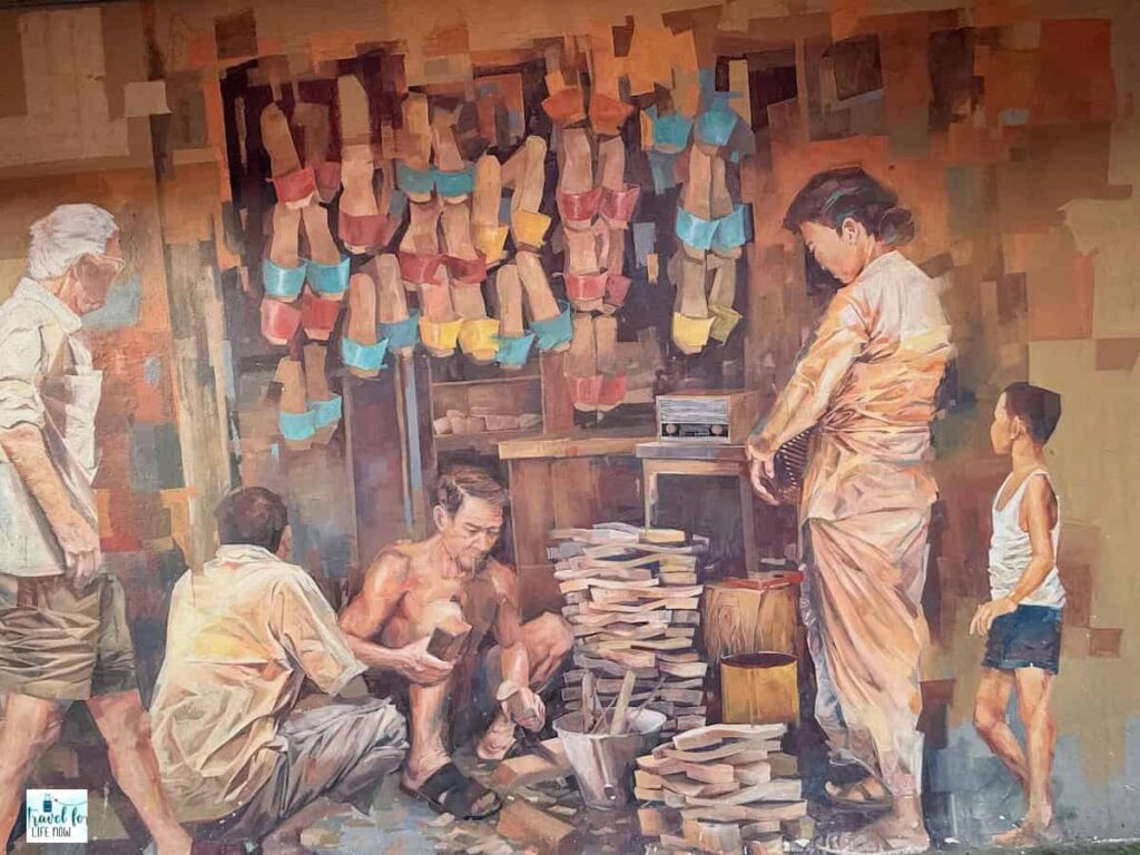 Mural of a clog maker in his shop.