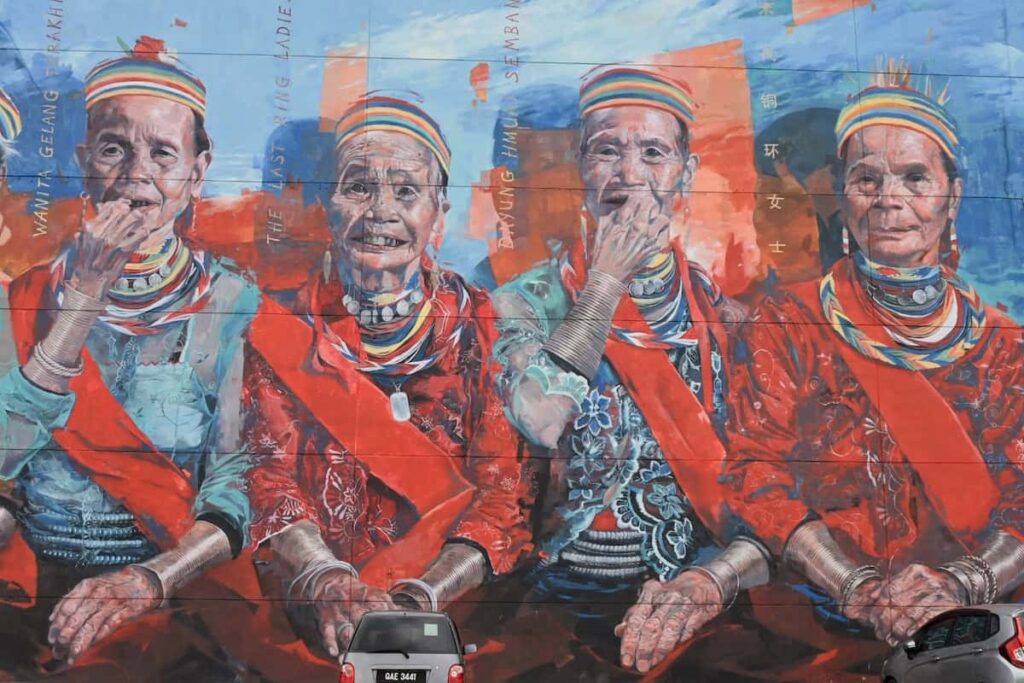 Photo os Street art The Last Ring Ladies mural--4 of the ladies in traditional attire for Kuching During Mansoon Season article