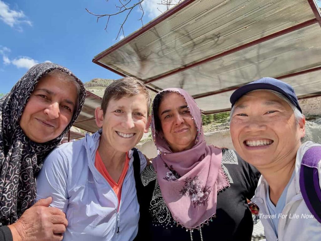 Four people in the photo. Dollmakers with Reggie and Sue