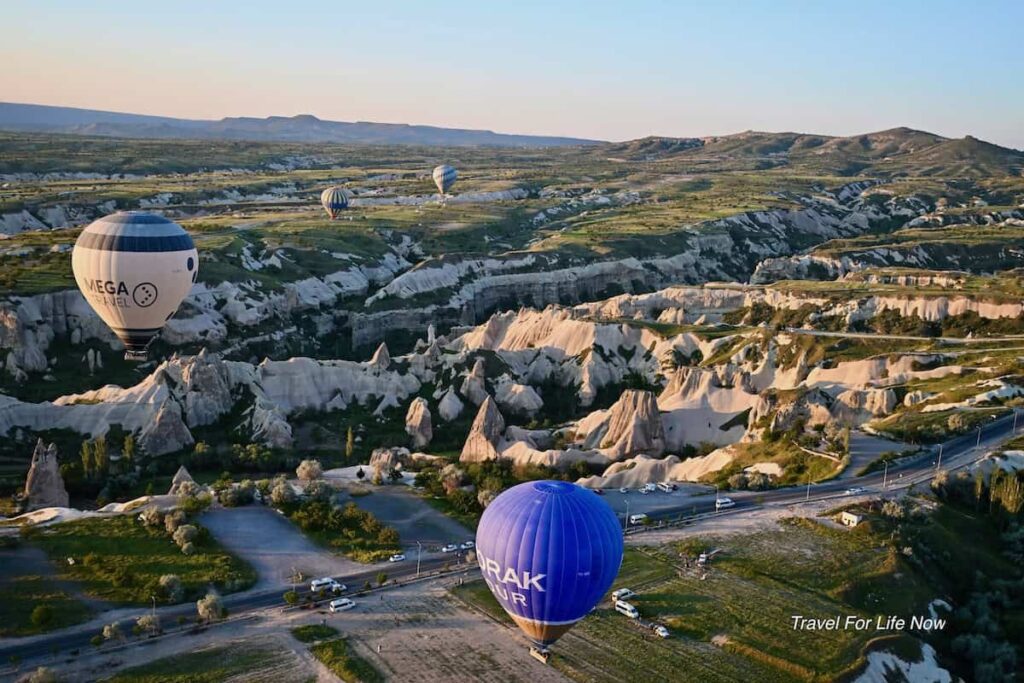 Blue Balloon In for ground and rock formations on a Cappadocia Balloon Flight